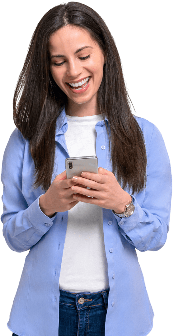 Woman smiling while using a smartphone.